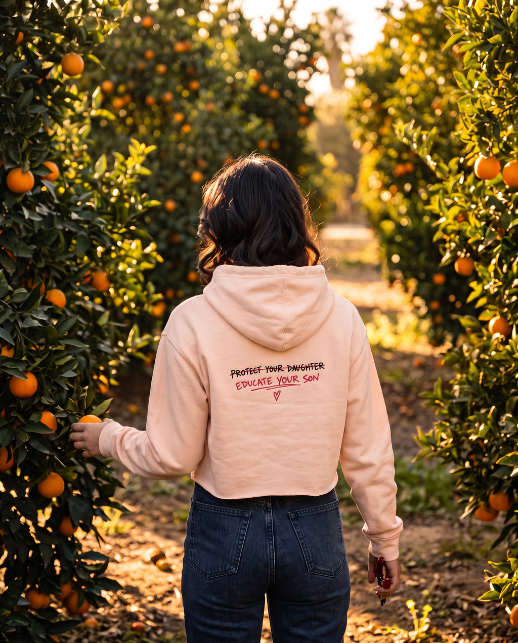 Protect Your Daughter Educate Your Son crop hoodie | small heart graphic